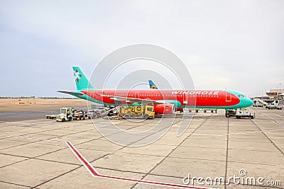 Sharm El Sheikh, Egypt - April 14, 2017: The loose luggage being loaded into narrow body aircraft Editorial Stock Photo