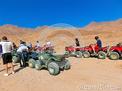 Sharm El Sheikh, Egypt - February 17, 2020: The people at quad tour in the desert in Egypt Editorial Stock Photo