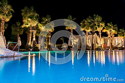 Sharm el-Sheikh, Egypt, 02/25/2019. Night landscape, interior of the hotel overlooking the pool, houses and palm trees Stock Photo