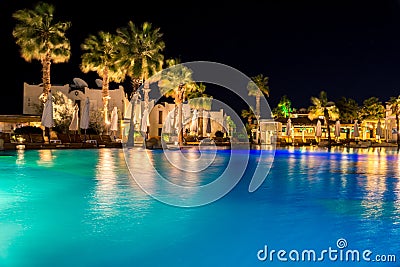 Sharm el-Sheikh, Egypt, 02/25/2019. Night landscape, interior of the hotel overlooking the pool, houses and palm trees Stock Photo