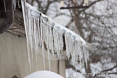 sharp icicles hang Stock Photo