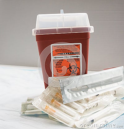Sharp items in a medical setting are safely stored Stock Photo