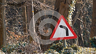 Sharp left turn warning side Stock Photo