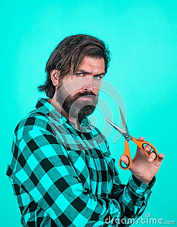 sharp styled. andsome hipster with moustache. hairdresser tool. barbershop. mature barber with scissors. bearded man Stock Photo