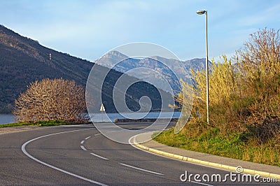 Sharp turn of road. View of Adriatic Highway Jadranska magistrala running along the coast of Bay of Kotor. Montenegro Stock Photo