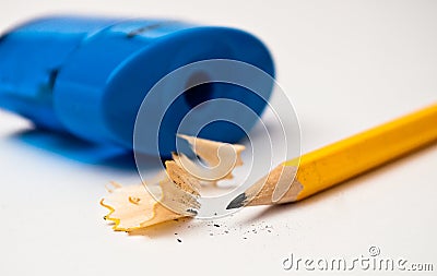 Sharp yellow pencil with blue sharpener Stock Photo