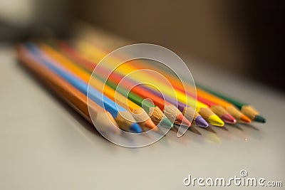 Sharpened pencils of different colors with a focus in the foreground. Stock Photo