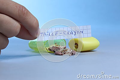 Sharpener with piece of paper saying Taille crayon in French Stock Photo