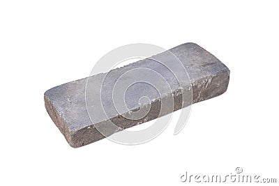 Sharpening or honing a knife on a waterstone, grindstone on the Stock Photo