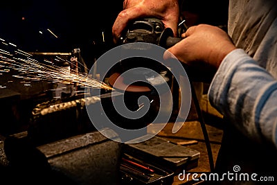 Sharpening Japanese sword with grinder Stock Photo