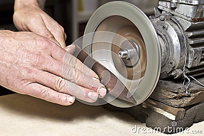 Sharpening knife process Stock Photo