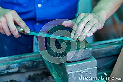 Sharpening knife with a whetstone Stock Photo