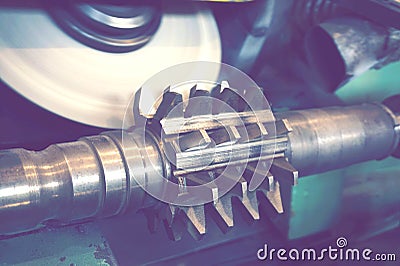 Sharpening of a worm cutter on a machine for cutting a tooth on a gear cutter. Stock Photo