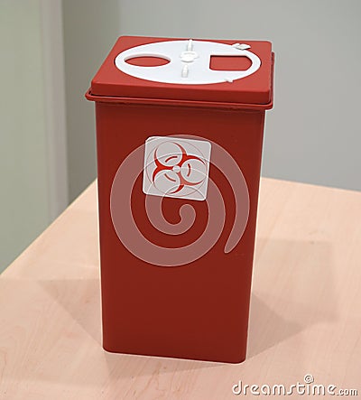 Sharps collector container on the table Stock Photo