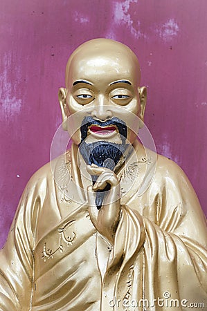 Golden Buddha figure at the Ten Thousand Buddhas Monastery, Hong Editorial Stock Photo