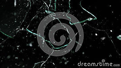 Shattered and broken glass pieces isolated on black Stock Photo