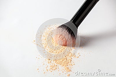 Shattered face powder on white background. Make up powder texture close up. Scattered matte powder Stock Photo