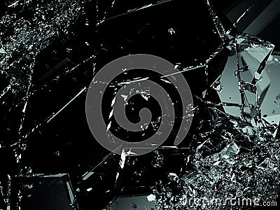 Shattered glass pieces on black background Stock Photo