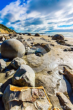 Shattered remnants of boulders Moeraki Stock Photo