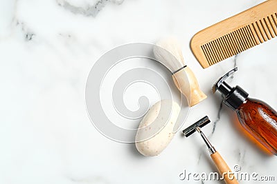 Shaving accessories for man on marble table. Flat lay composition with handmade soap, razor, shaving brush, bottle with foam gel, Stock Photo