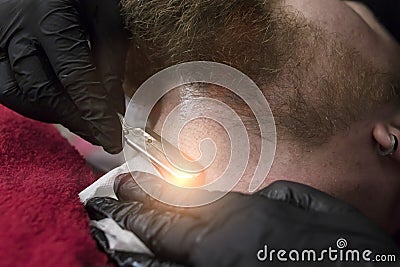 Shaving a beard and neck with a straight razor Stock Photo