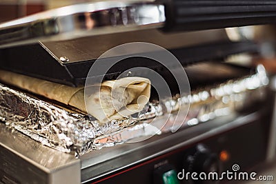 Shawarma doner baked in an electric oven in a fast food restaurant Stock Photo