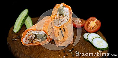 Shawarma fresh roll of lavash, chicken beef shawarma falafel, grilled meat, mushrooms, cheese. Traditional Middle Eastern snack. Stock Photo