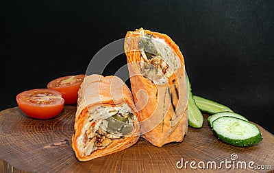 Shawarma fresh roll of lavash, chicken beef shawarma falafel, grilled meat, mushrooms, cheese. Stock Photo