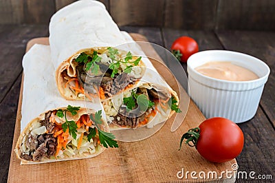 Shawarma sandwich - fresh roll of thin lavash pita bread Stock Photo