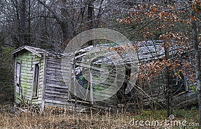 Abandoned shed with in a forest falling apart Stock Photo
