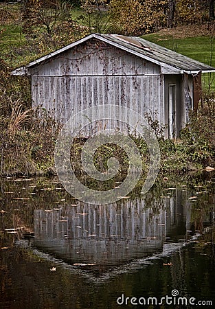 Shed with a Pond Reflection Stock Photo