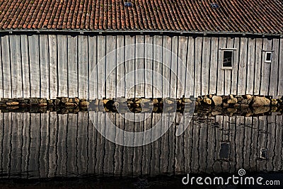 Shed reflection over water Stock Photo