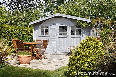 Shed with terrace and garden furniture Stock Photo