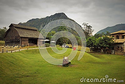 Sheep farm that is surrounded by mountains. Editorial Stock Photo