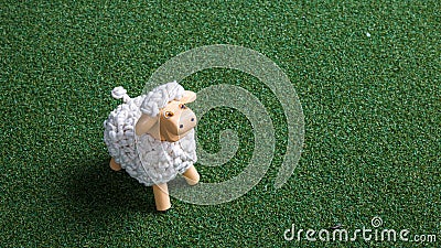 Sheep toy in the grass carpet Stock Photo