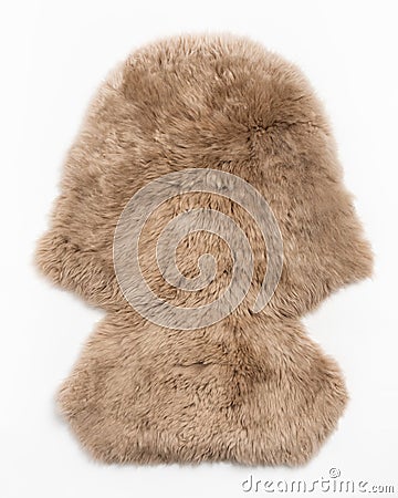 Sheepskin fur carpet on white background Stock Photo