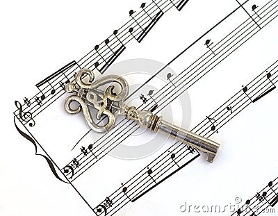 Sheet music staff & old key with treble clef Stock Photo