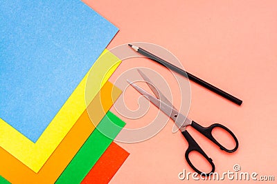 Sheets of colored cardboard, scissors and pencil Stock Photo