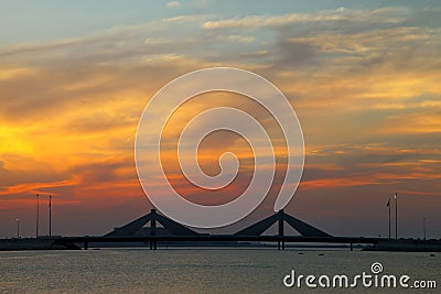 Sheikh Isa Bin Salman causeway Bridge during sunset Stock Photo