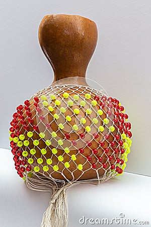 Isolated Shekere or Sekere, Close up of the bead net, a Nigeria, Yoruba percussion musical instrument. Stock Photo