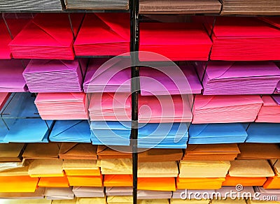 Shelf with envelopes and colored sheets Stock Photo