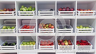 shelf with fruits and vegetables boxes green red Stock Photo