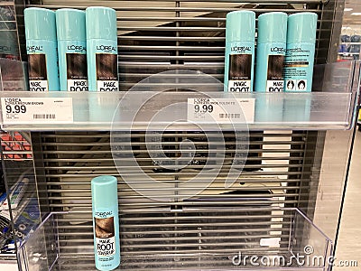 Eau Claire, Wisconsin - March 30, 2020: Shelf of L`Oreal Magic Root Cover Up display is nearly empty, due to beauty and hair salon Editorial Stock Photo