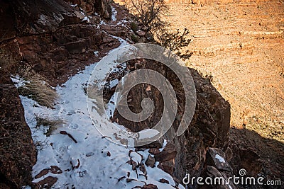 Shelf Trail Covered In Snow With Fresh Mountain Lion Prints Stock Photo