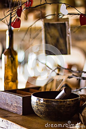 Shelf with vintage things. brass mortar Stock Photo