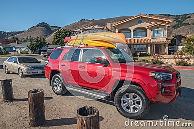 Shell Beach street view, cars with kayaks mounted on top. Shell Beach is a best spot along the coast for diving and kayaking Editorial Stock Photo