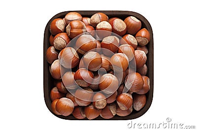 Shelled forest nuts in square bowl isolated on white background. organic food, top view Stock Photo