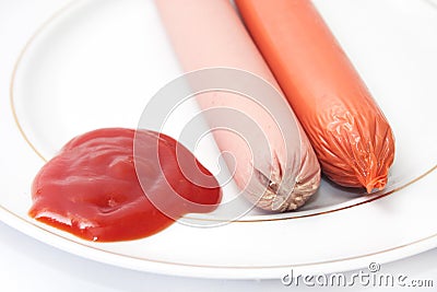 Shelled frankfurters on a plate with ketchup Stock Photo