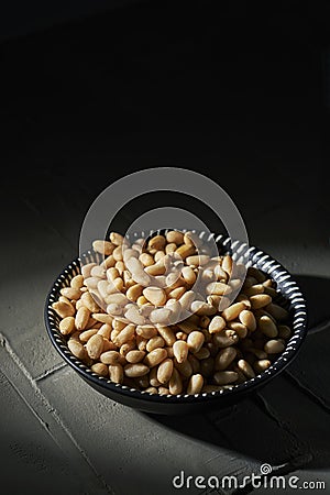 Shelled pine nuts in a bowl Stock Photo