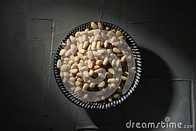 Shelled pine nuts in a bowl Stock Photo